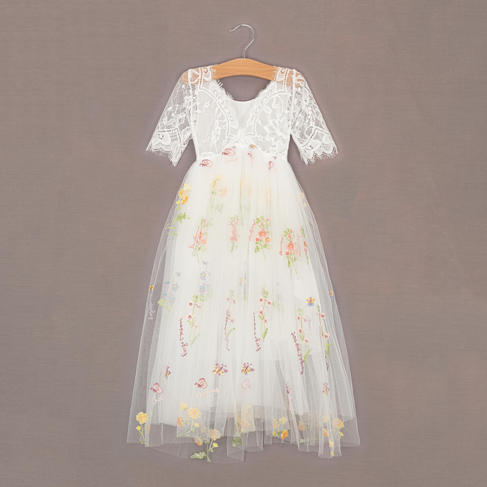 White lace detailing at rear of the dress