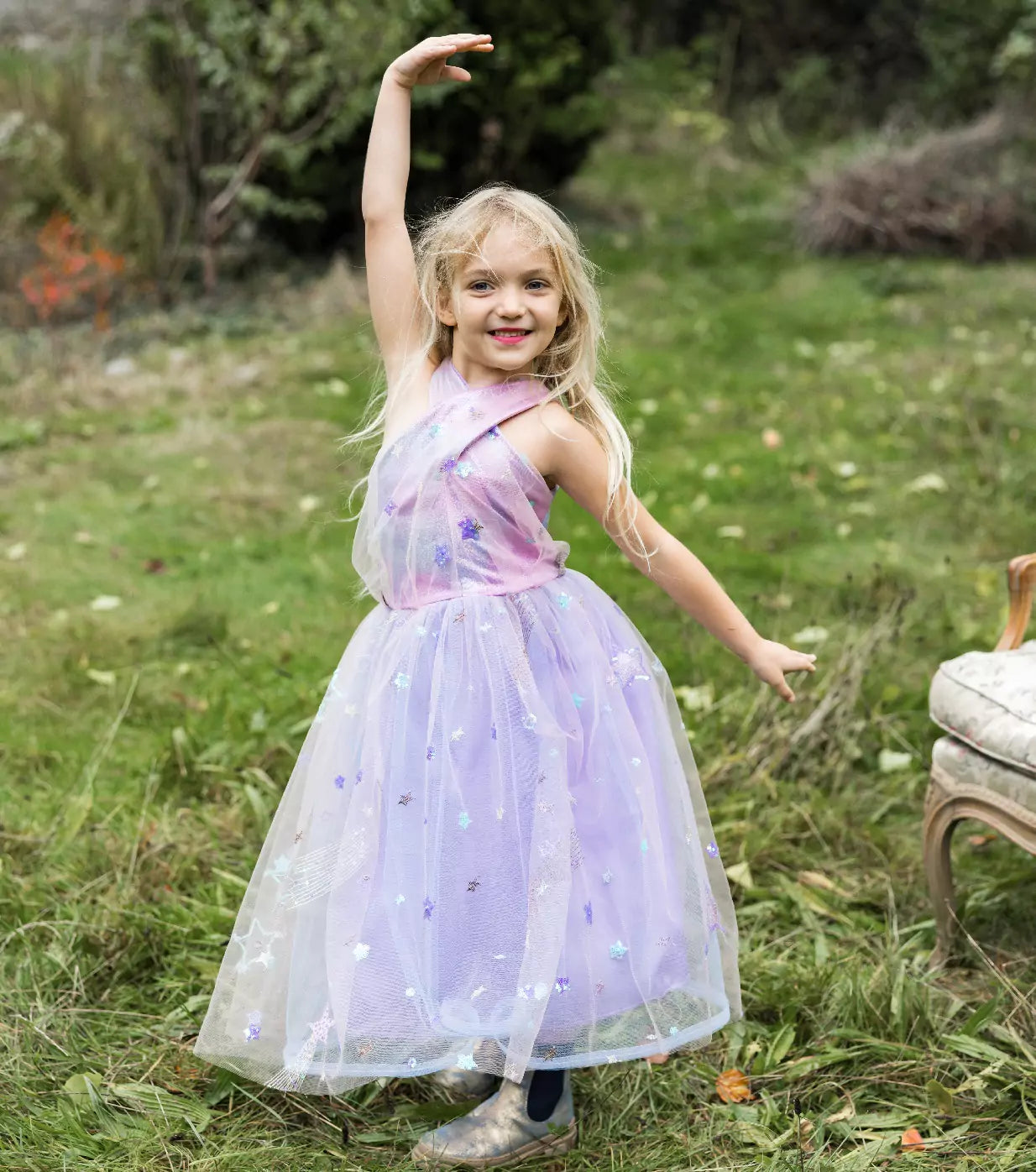 young girl standing in field