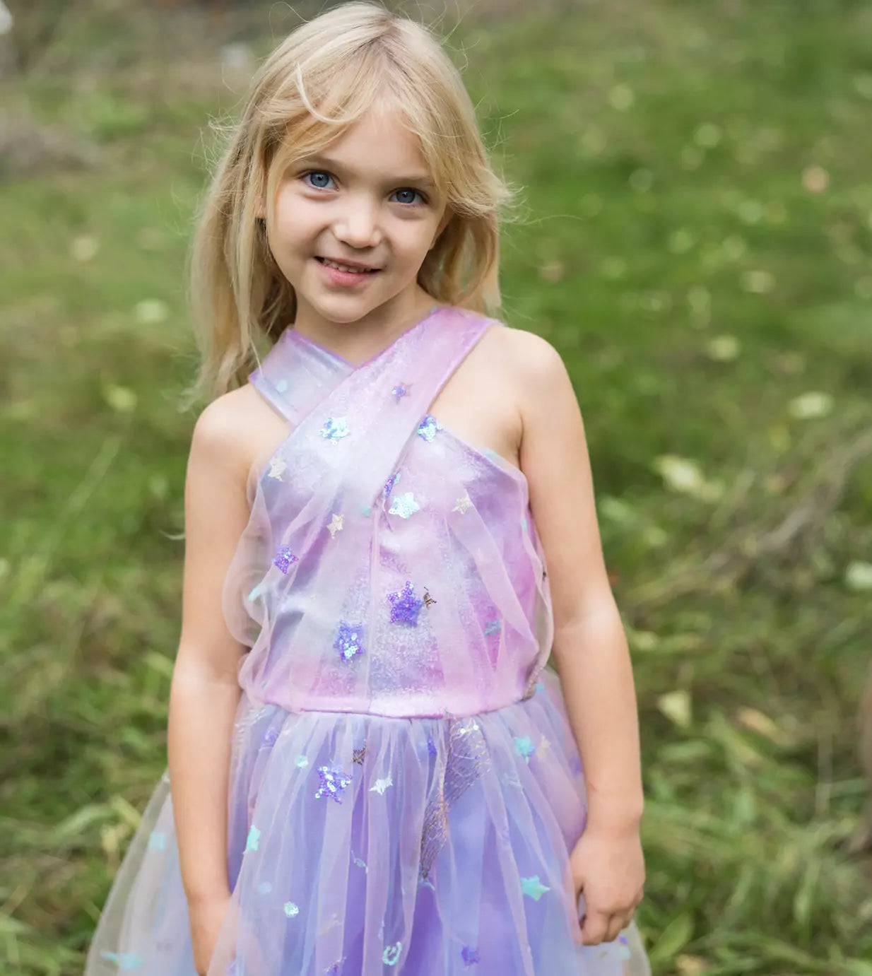 young girl standing in field