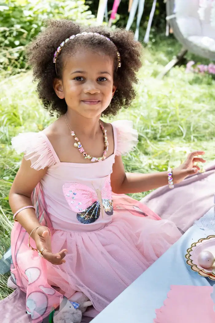 young girl wearing her butterfly fairy dress from The Fairy Princess