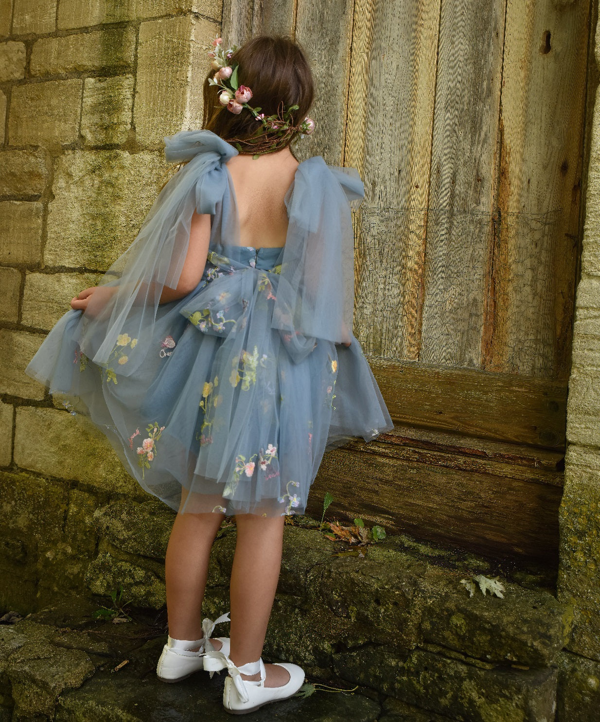 young girl swirling in her dress