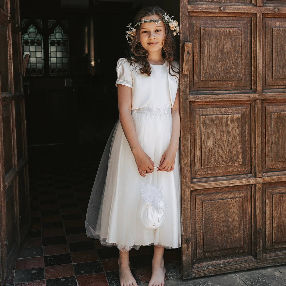 Flower Girl wearing Harper Dress in a church
