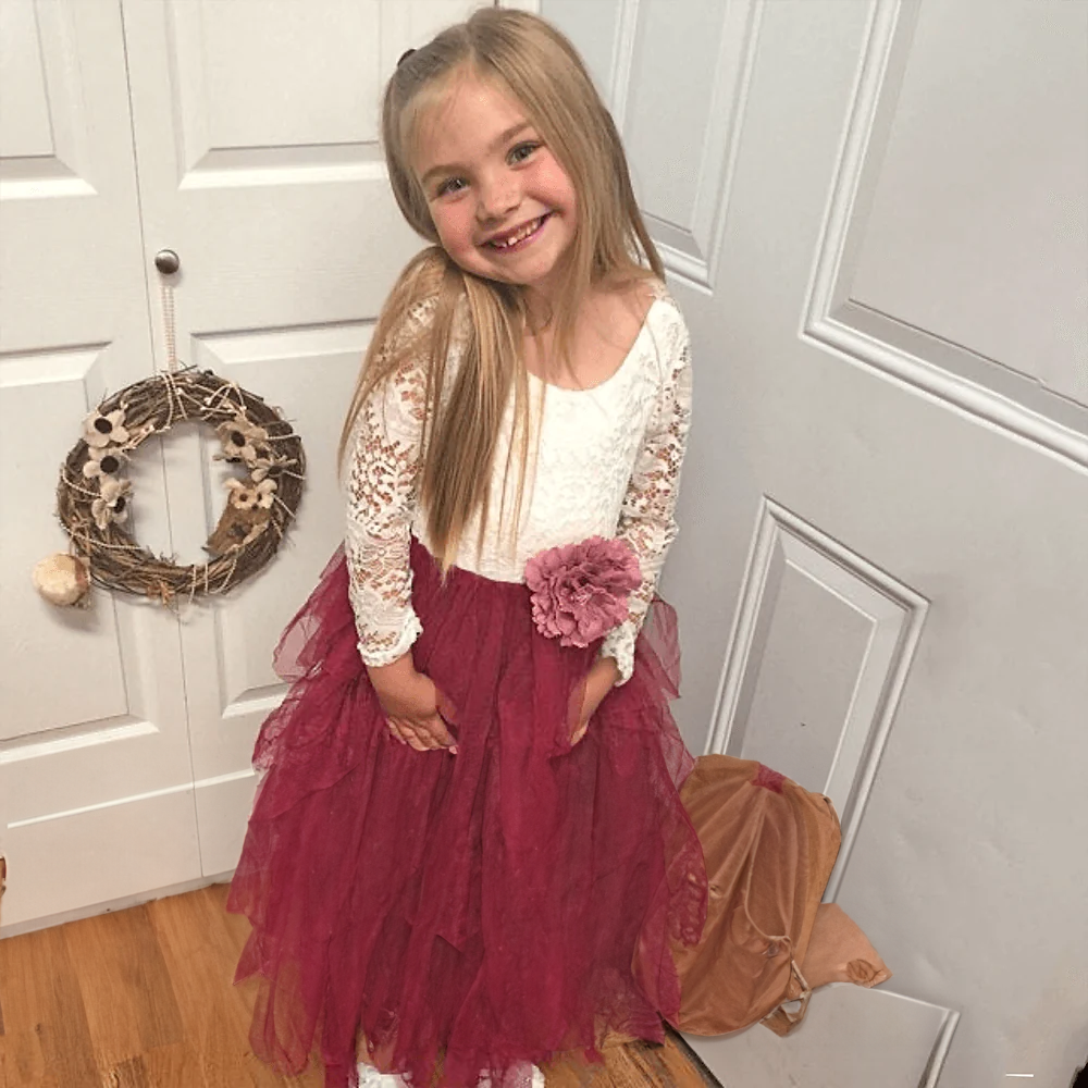 girl wearing a flower girl dress from UK Flower Girl Boutique