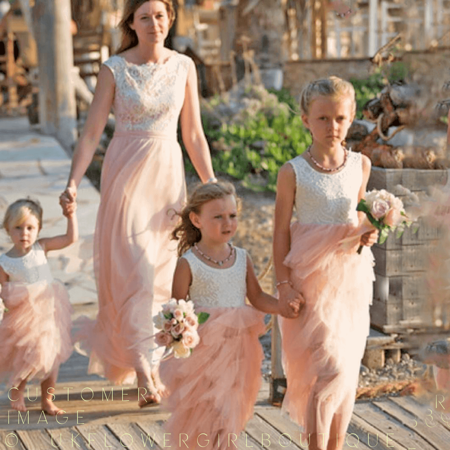bridesmaids wearing Bohemian Spirit Dress in blush