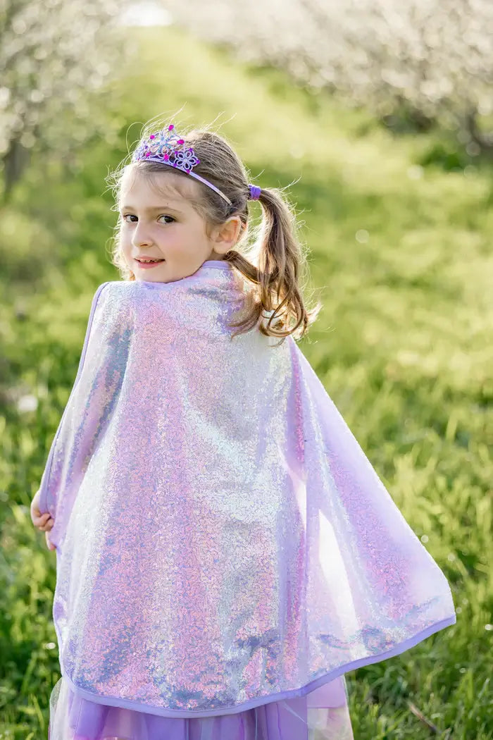 young girl dressed as a fairy with the lilac sequin cape
