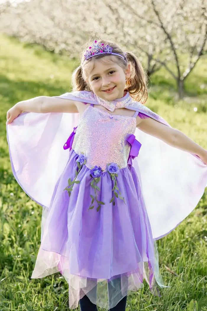 pretty girl dressed as a fairy in the lilac cape and dress