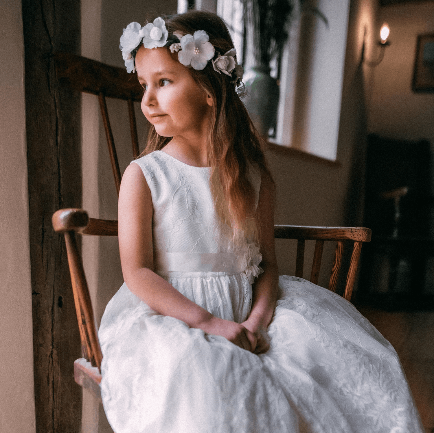 Young girl wearing a Lilliana Dress in Ivory