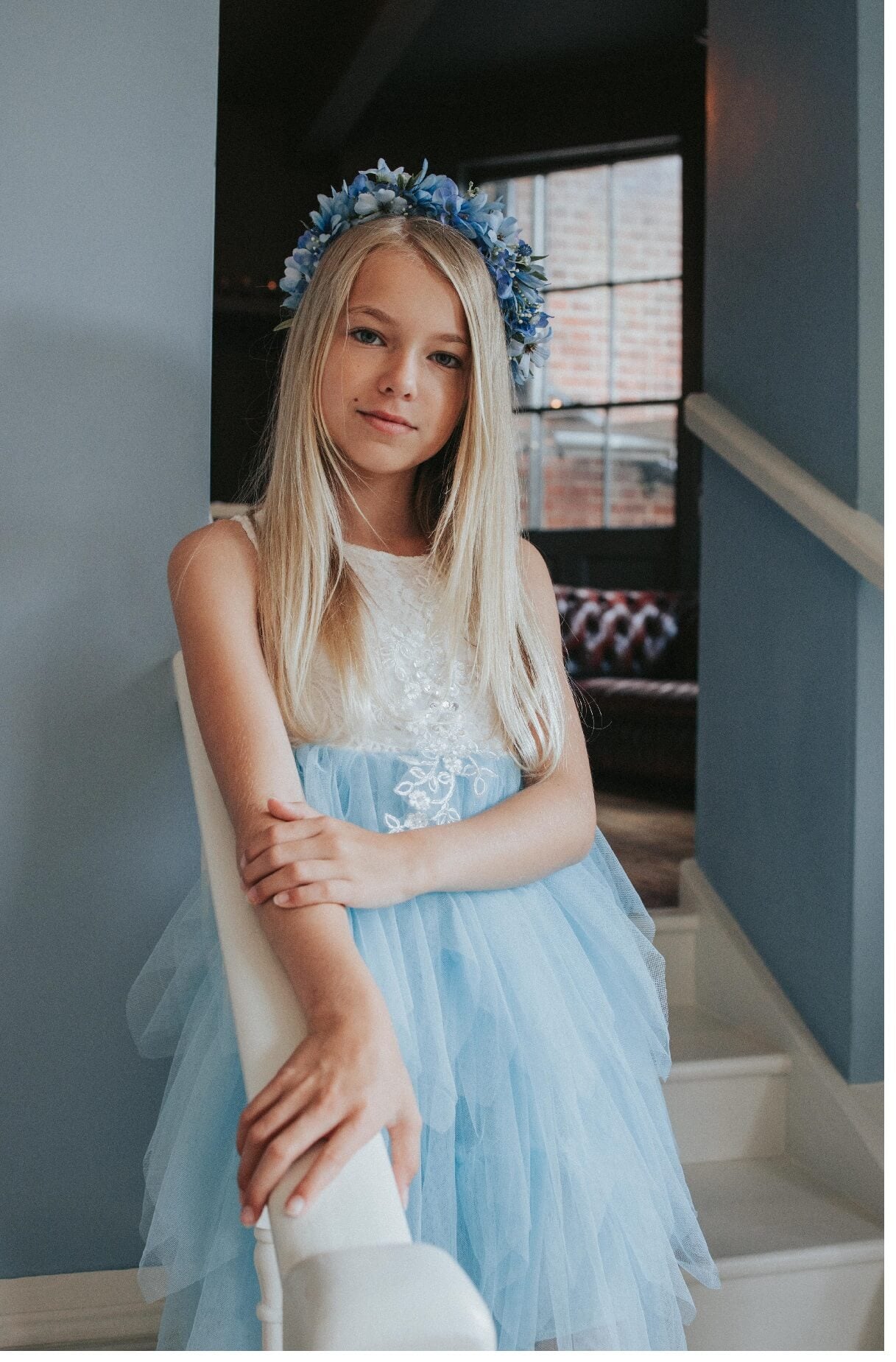 girl smiling walking down stairs