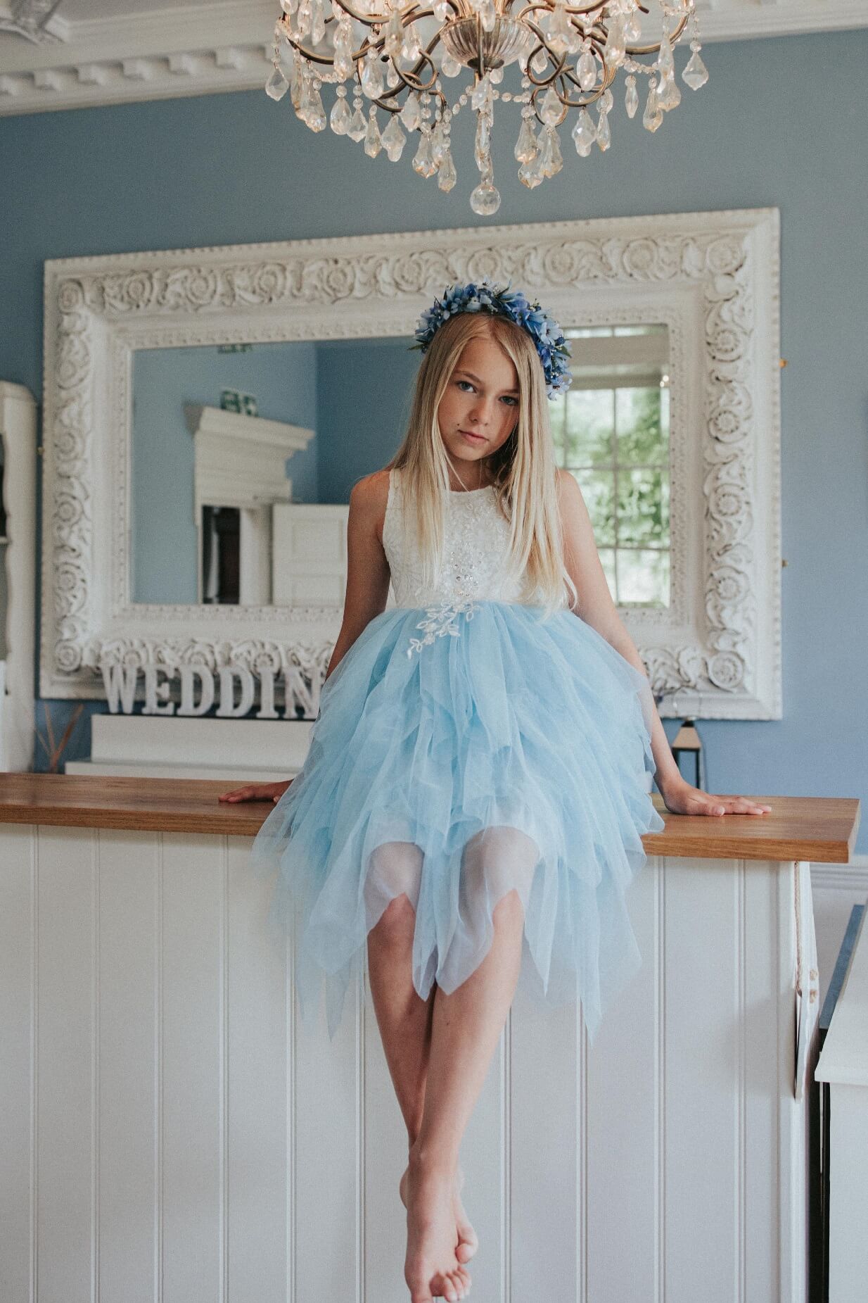 girl sitting on side table