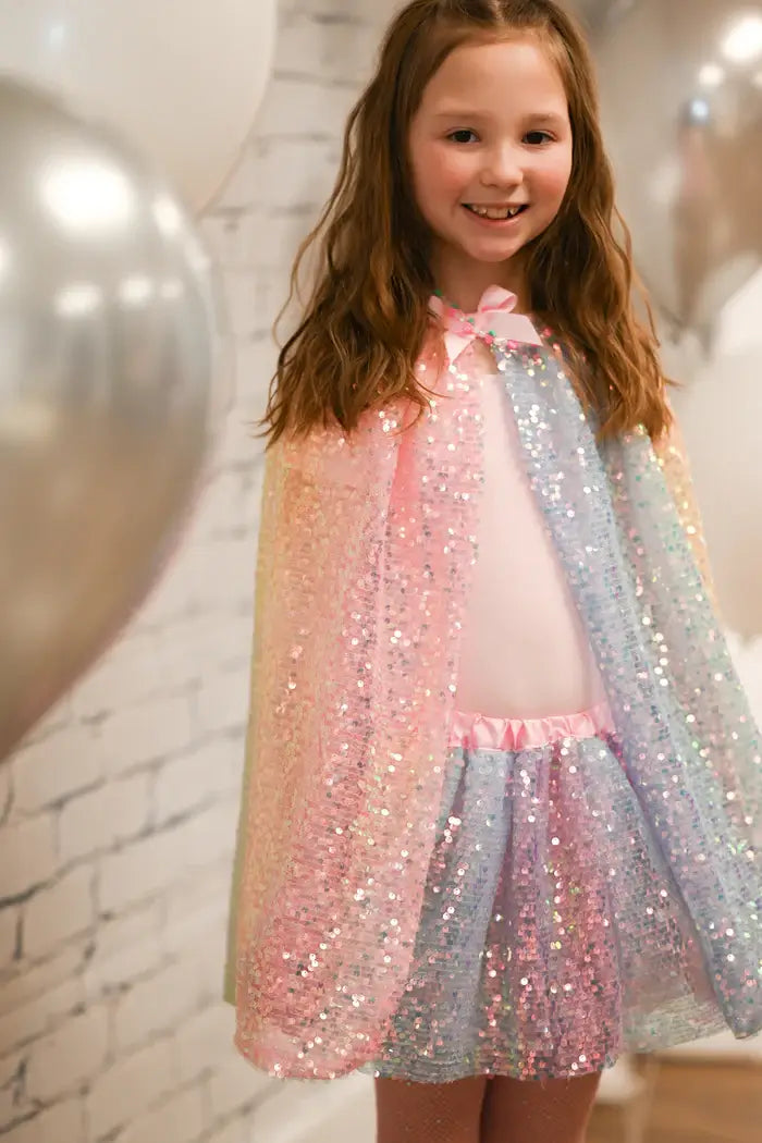 pretty girl wearing cape and tutu