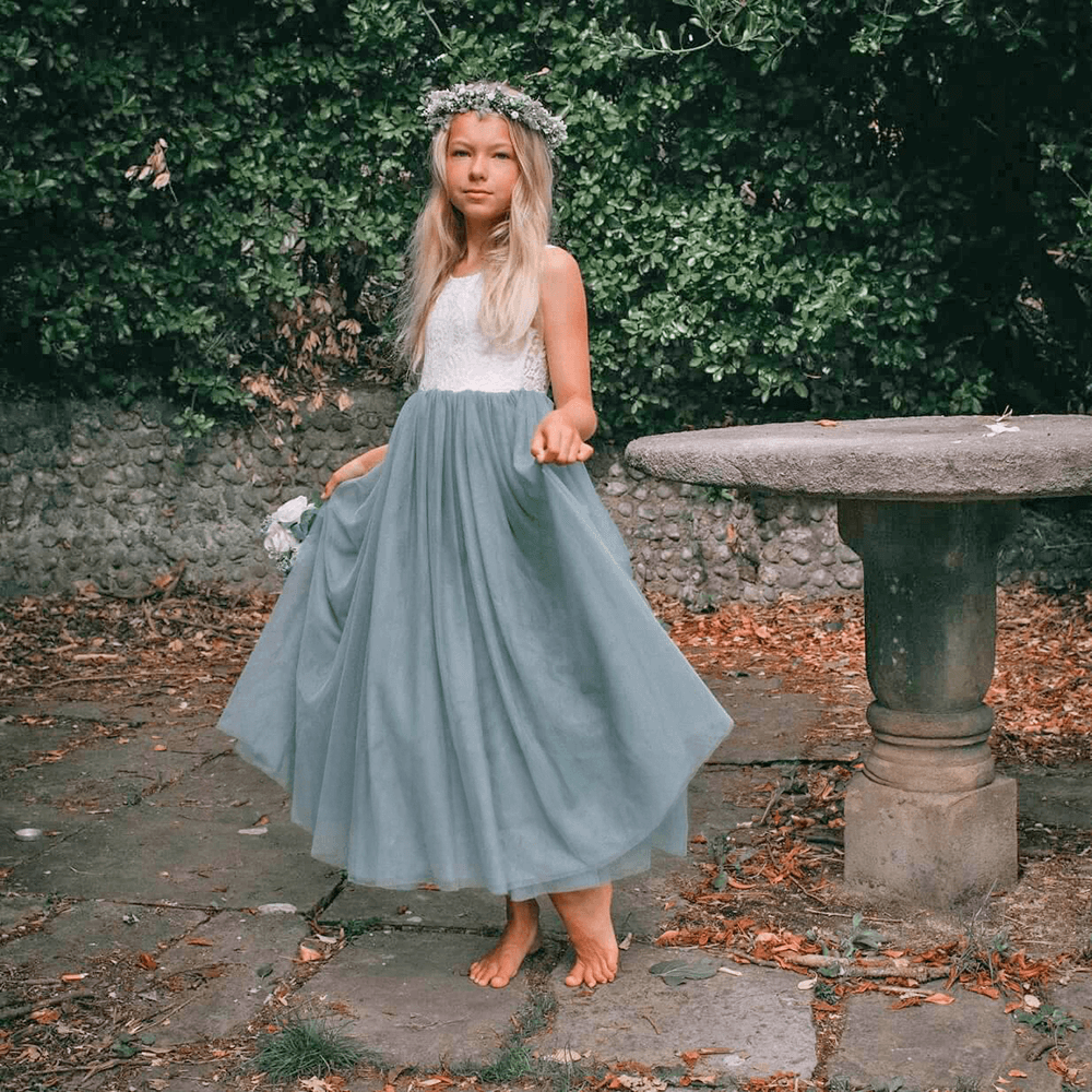 Girl wearing a pretty bohemian flower girl dress