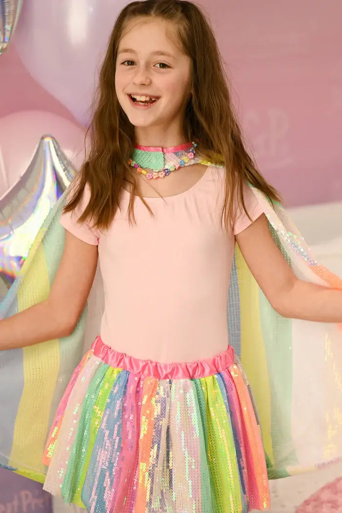 girl wearing sequin cape and tutu