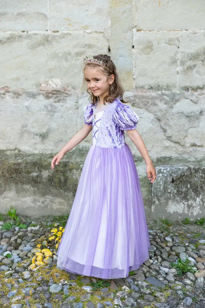 Girl wearing Princess dress playing