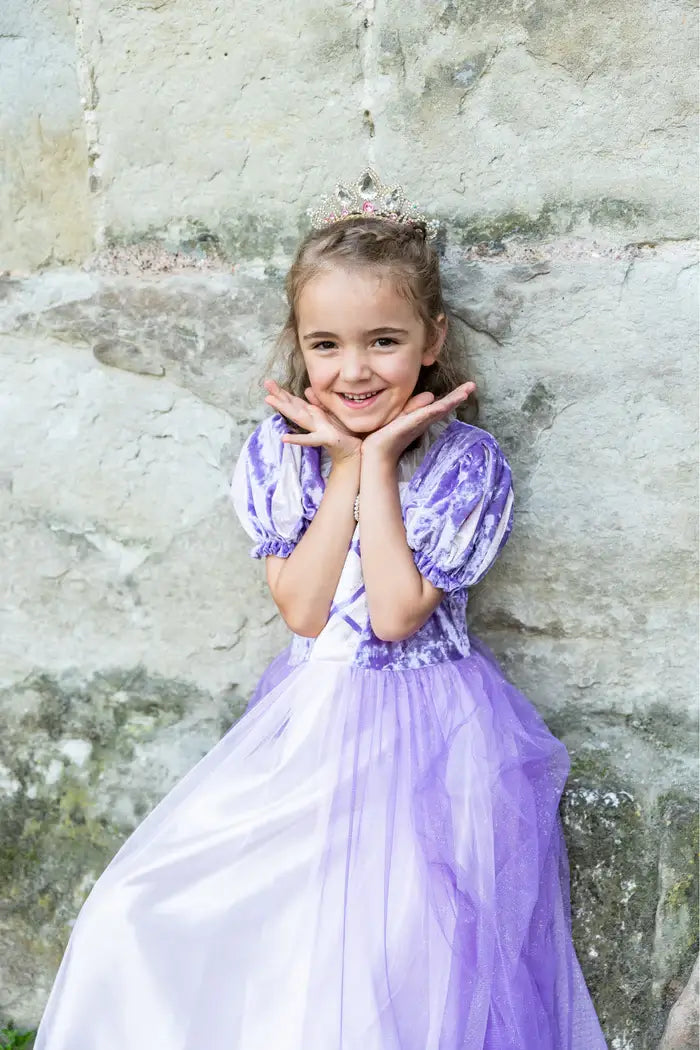 Girl wearing Princess dress playing