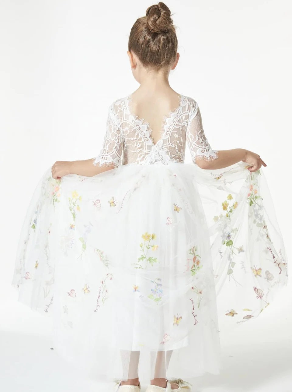 young girl holding dress