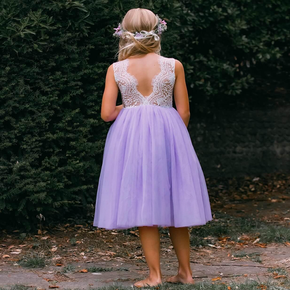 Flower girl showing off the detail on the back of a Lilac Classic Tea Length Dress