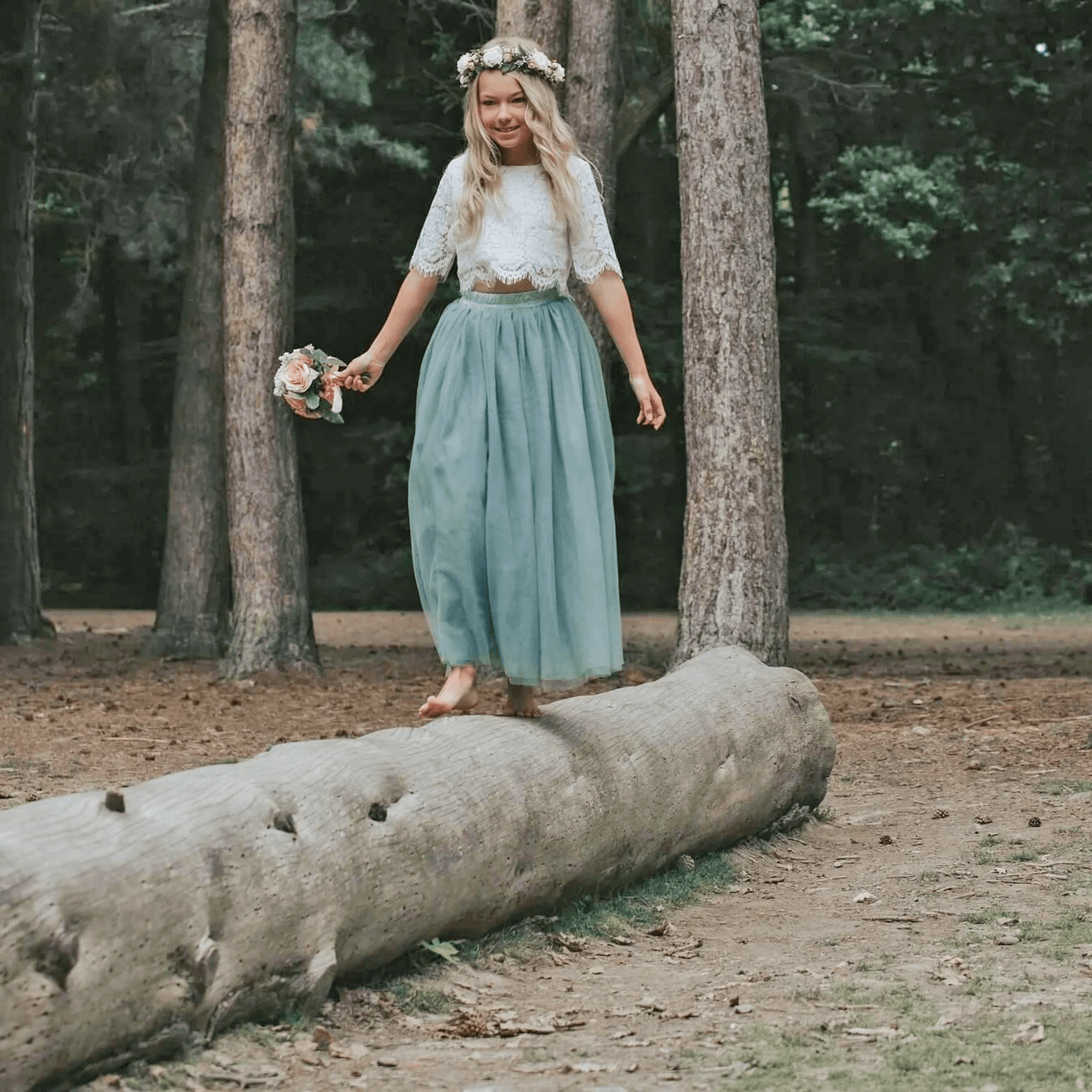 Girl wearing dress and holding flower bouquet