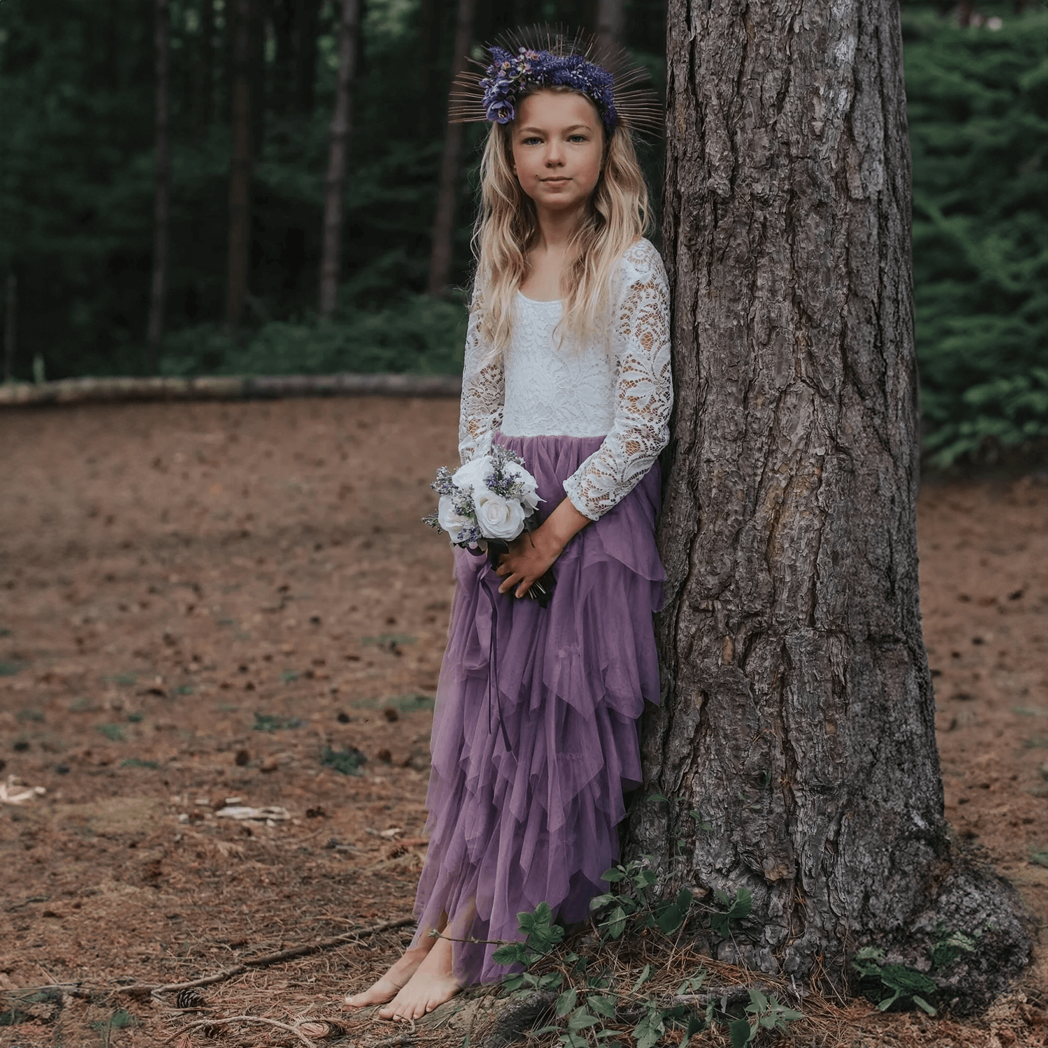Girl wearing dress and holding flower bouquet
