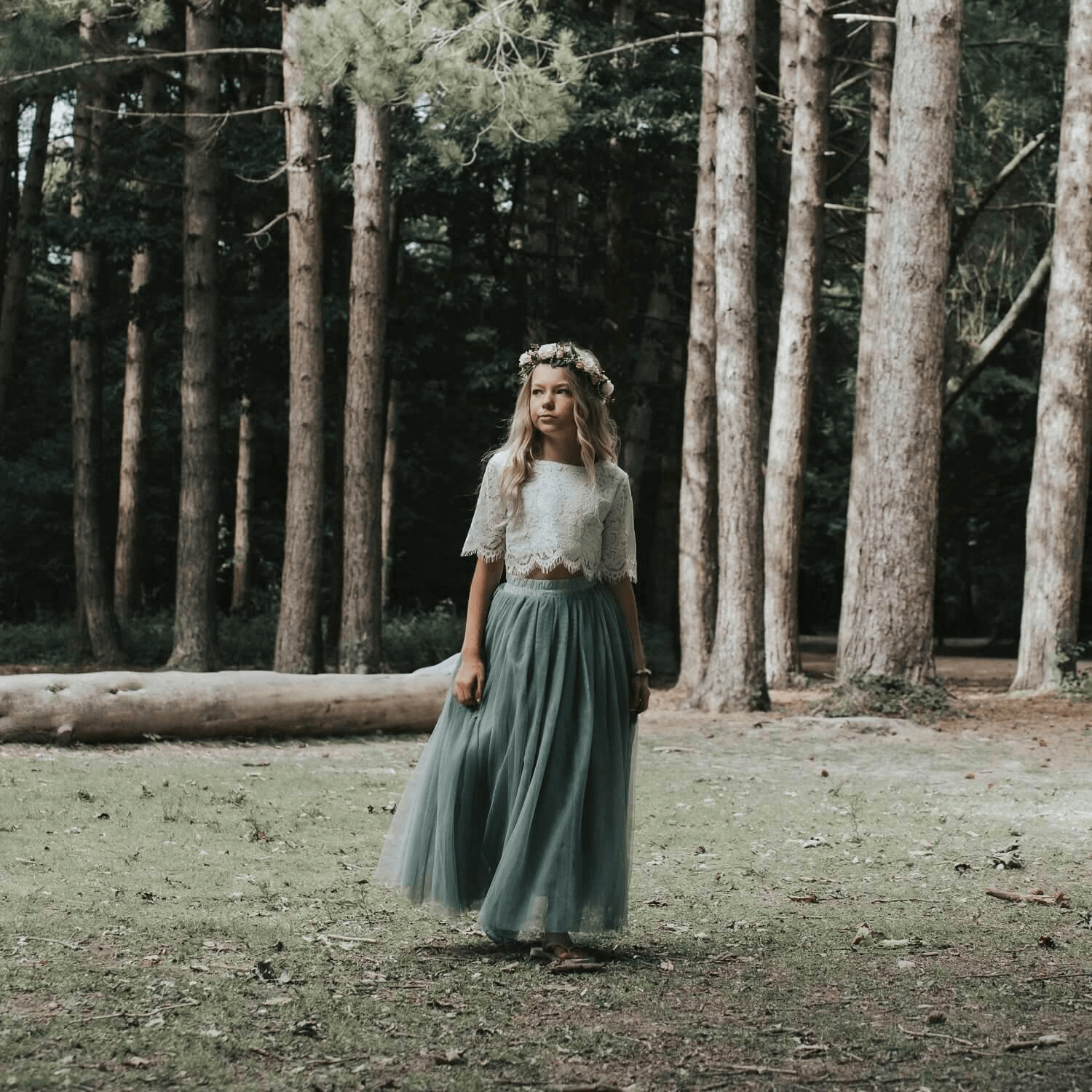 Flower Girl walking in a forest