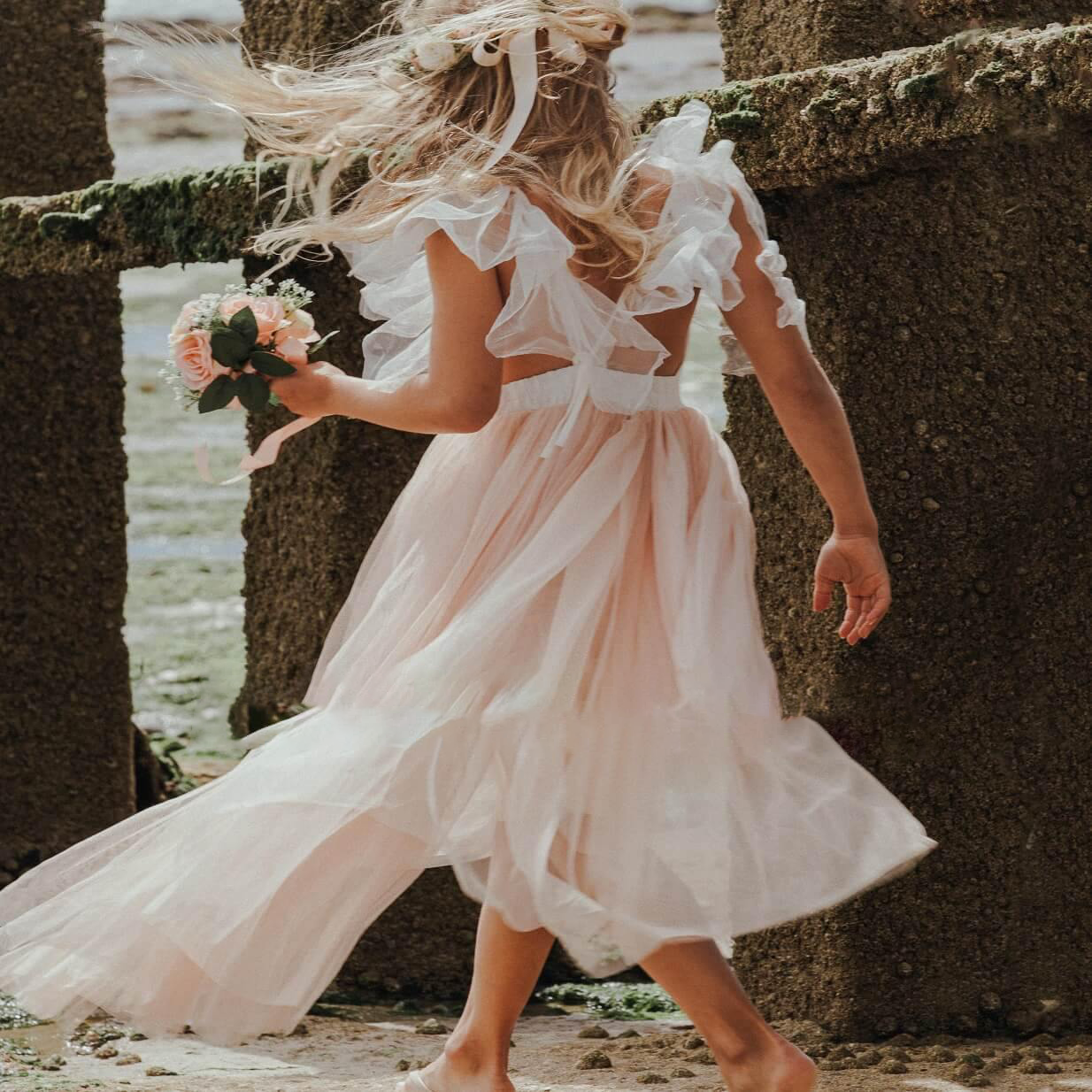 Girl in pretty dress at beach