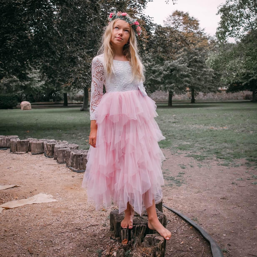 Flower Girl in Pink Dress standing in a park