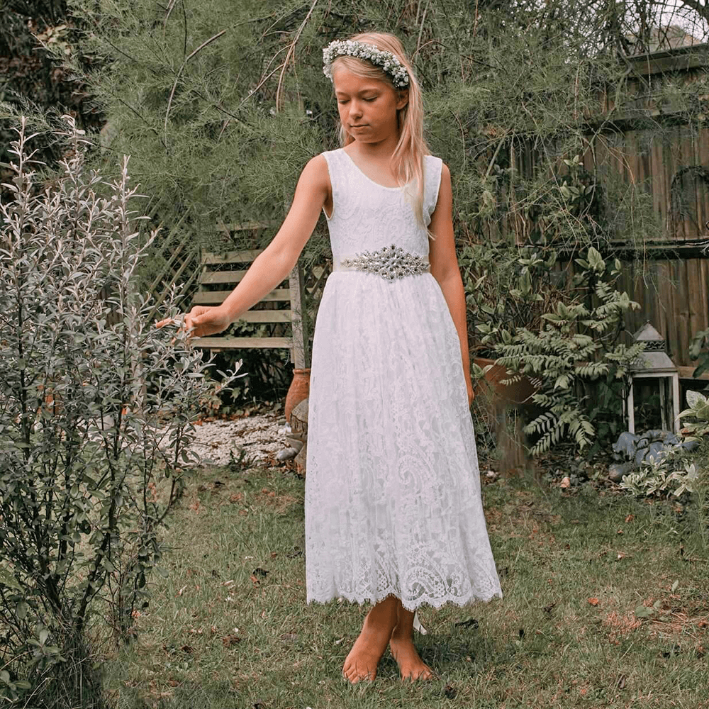 girl in a lace flower girl dress