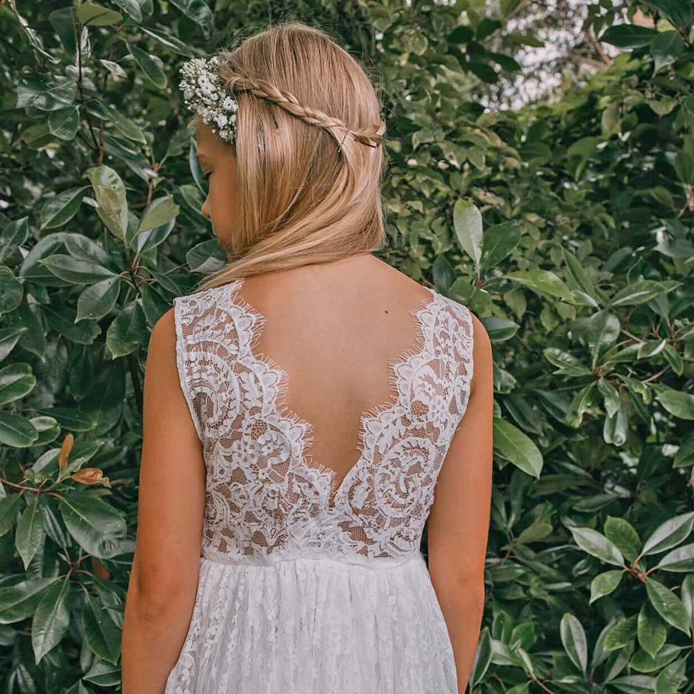 girl in a lace flower girl dress