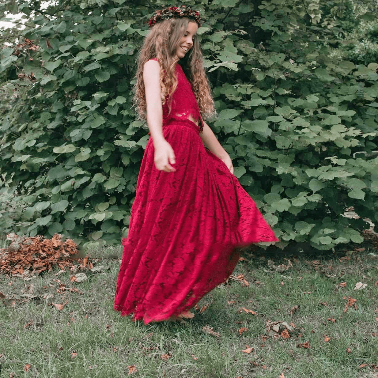 girl wearing a burgundy party outfit
