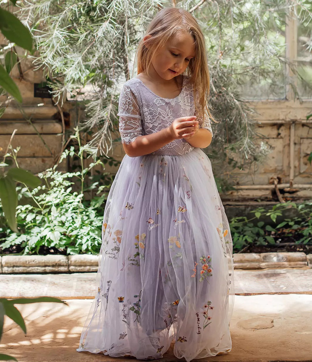 pretty girl wearing flower girl dress
