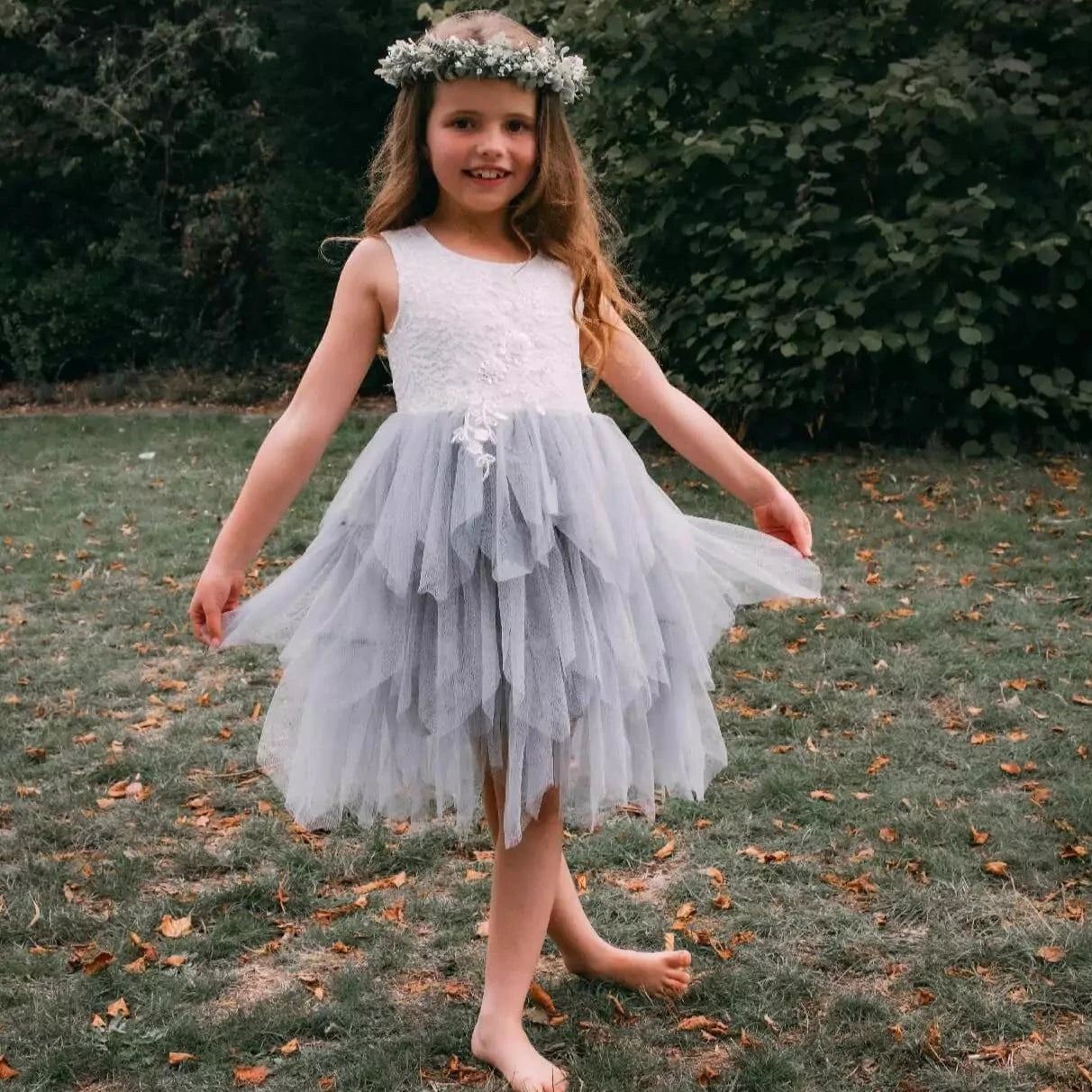 girl holding onto dress