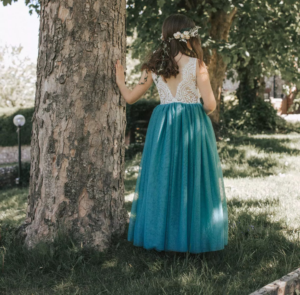 flower girl wearing teal tulle dress