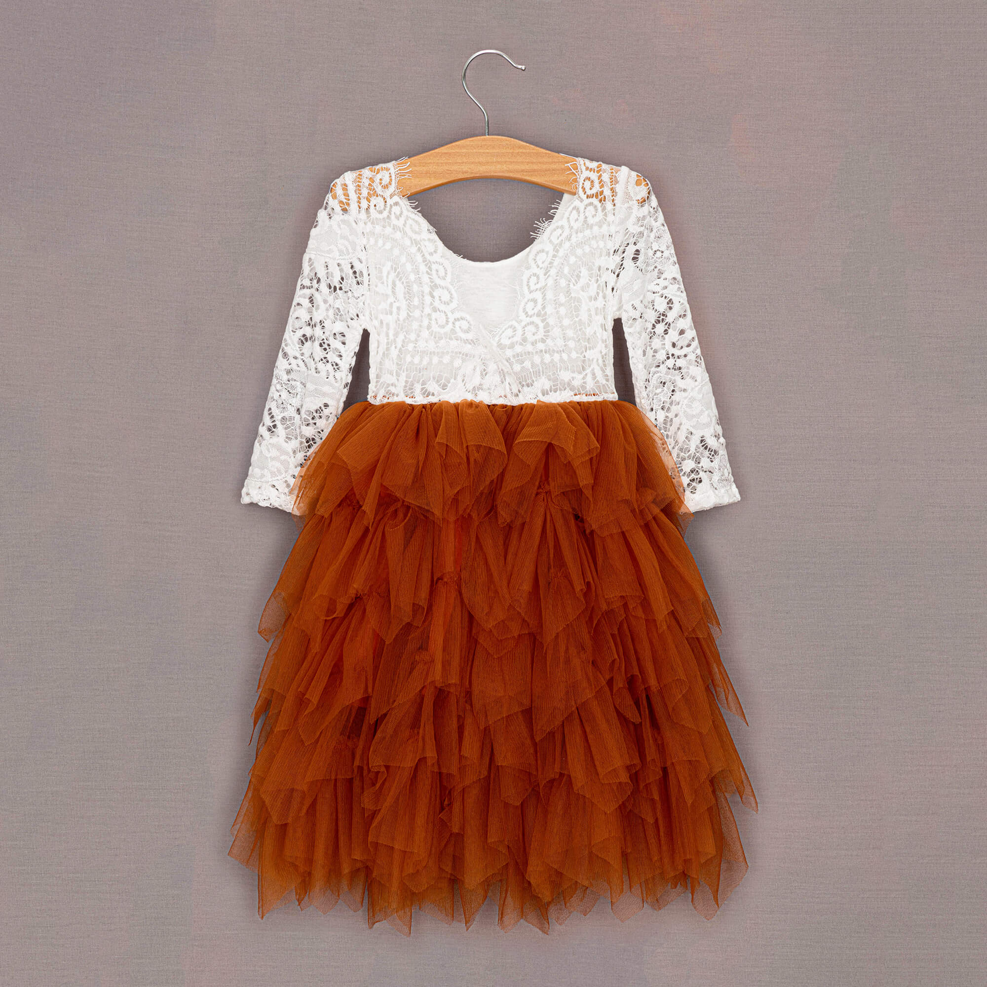 Burnt Orange tulle dress on hanger#