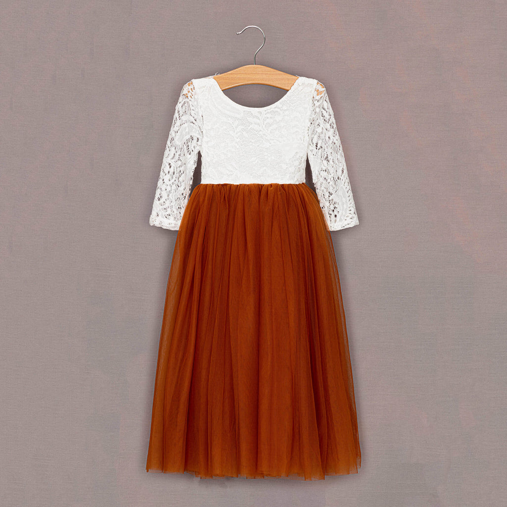 Burnt orange tulle dress on hanger