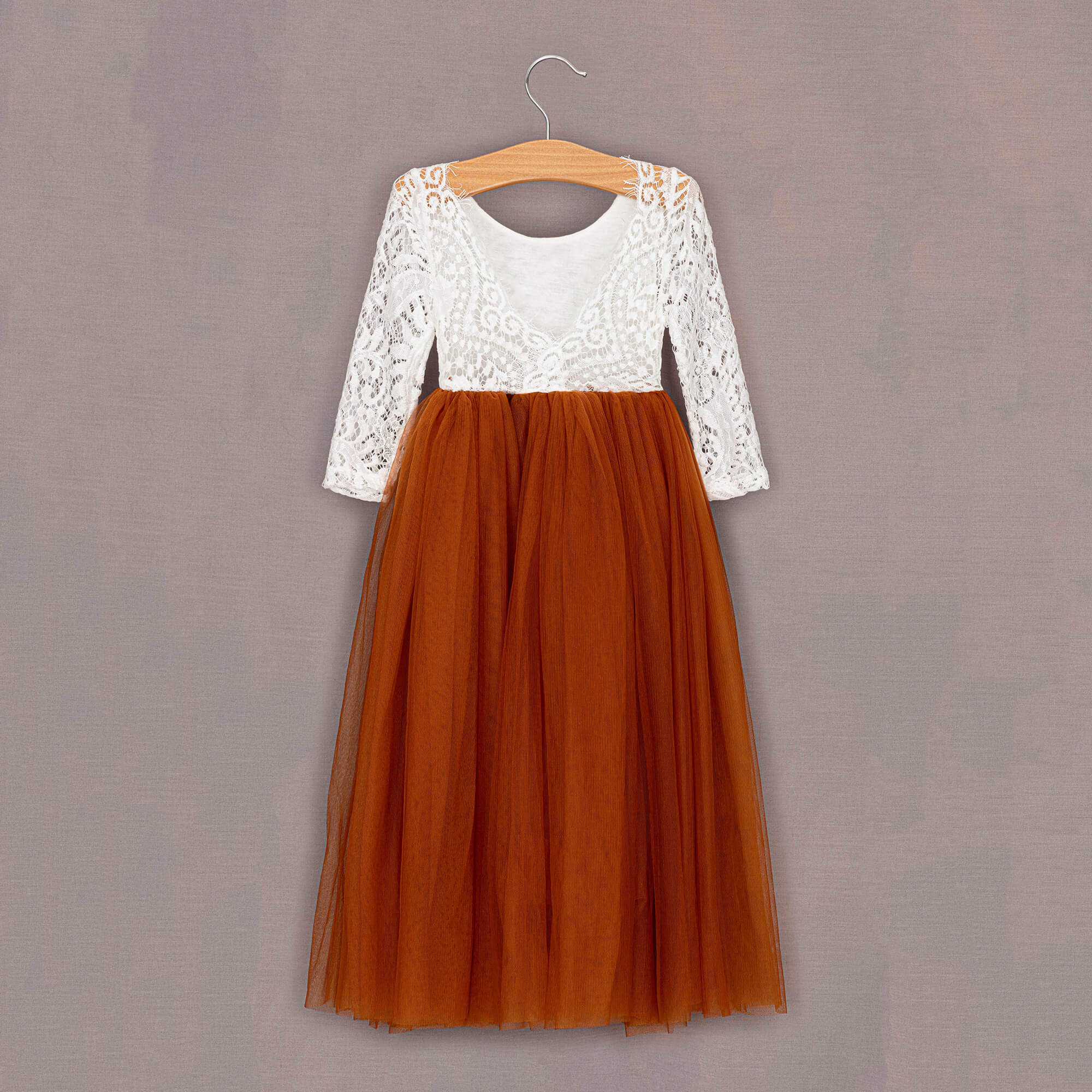 Rear Burnt orange tulle dress on hanger