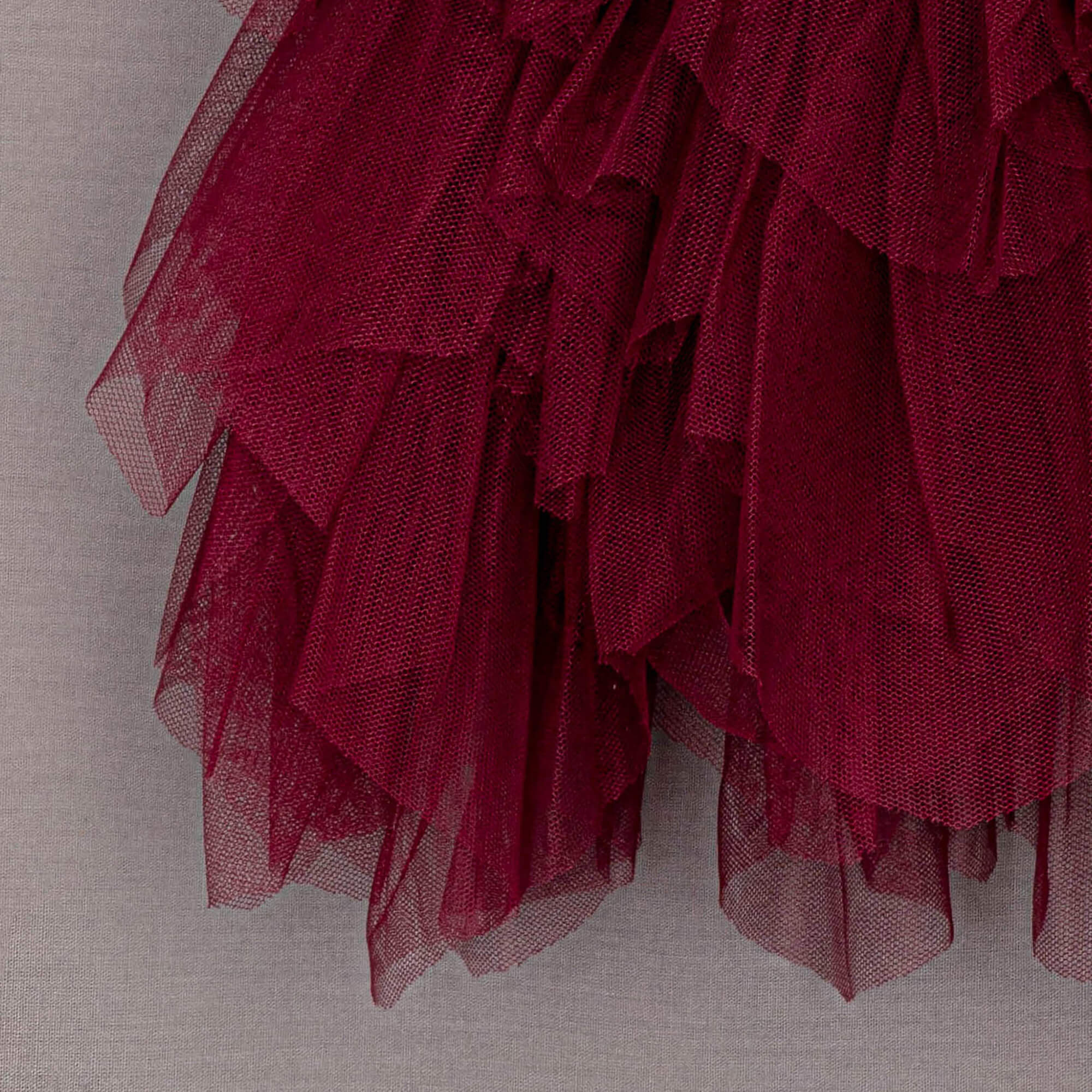 Close up of red ruffles from skirt