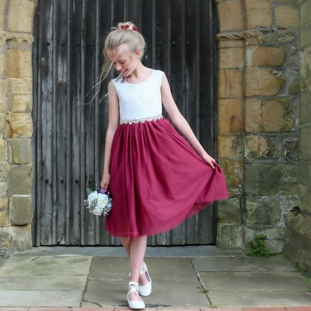 Girl wearing a tea length flower girl dress