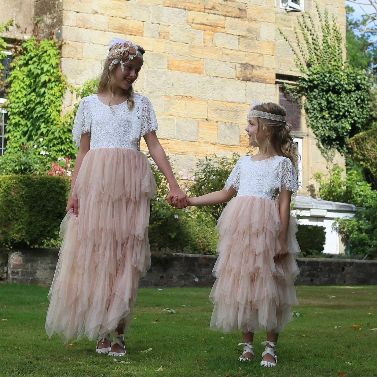 Girls holding hands at a wedding