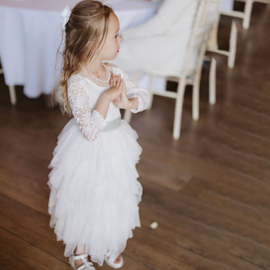 Young girl at a wedding in UK Flower Girl Boutique dress
