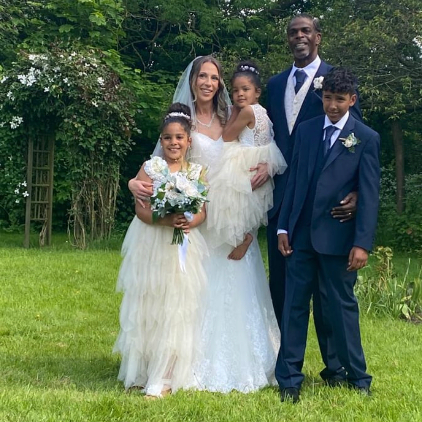 Bride and her groom with 2 flower girls