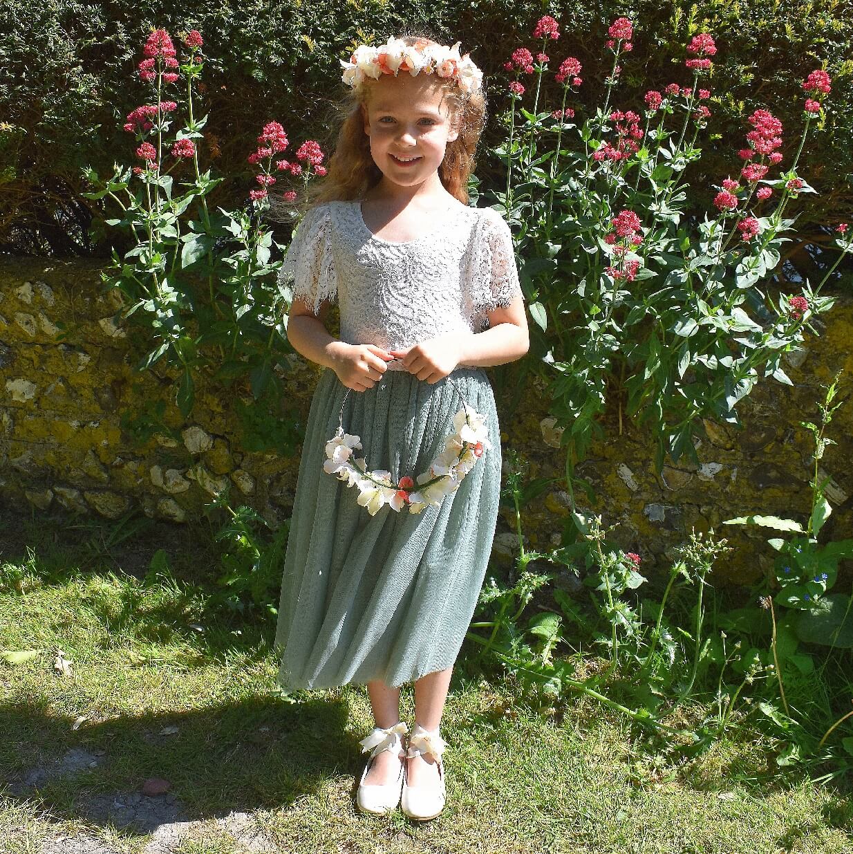 A tea length dress in sage green