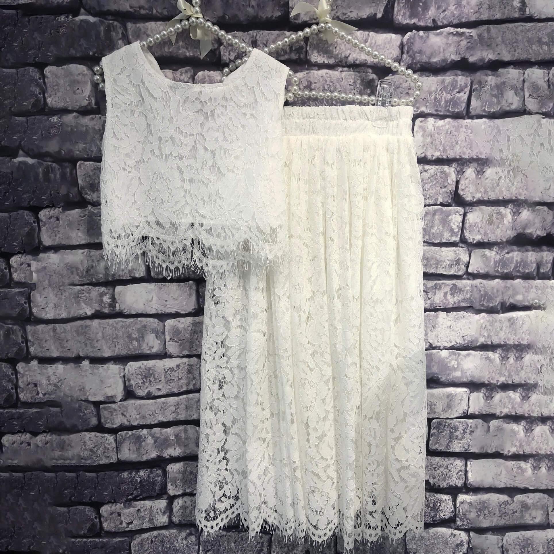 girls white outfit on hangers