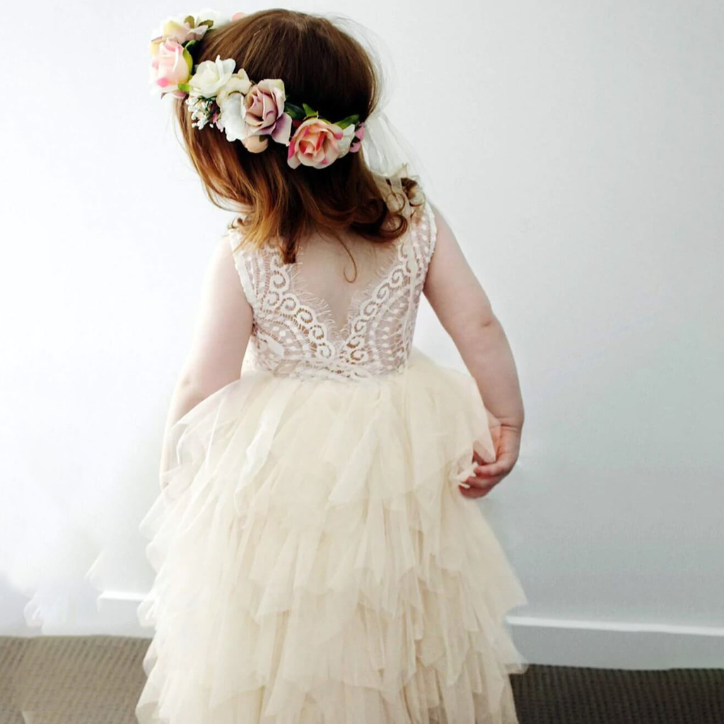 Young girl wearing pretty flower girl dress