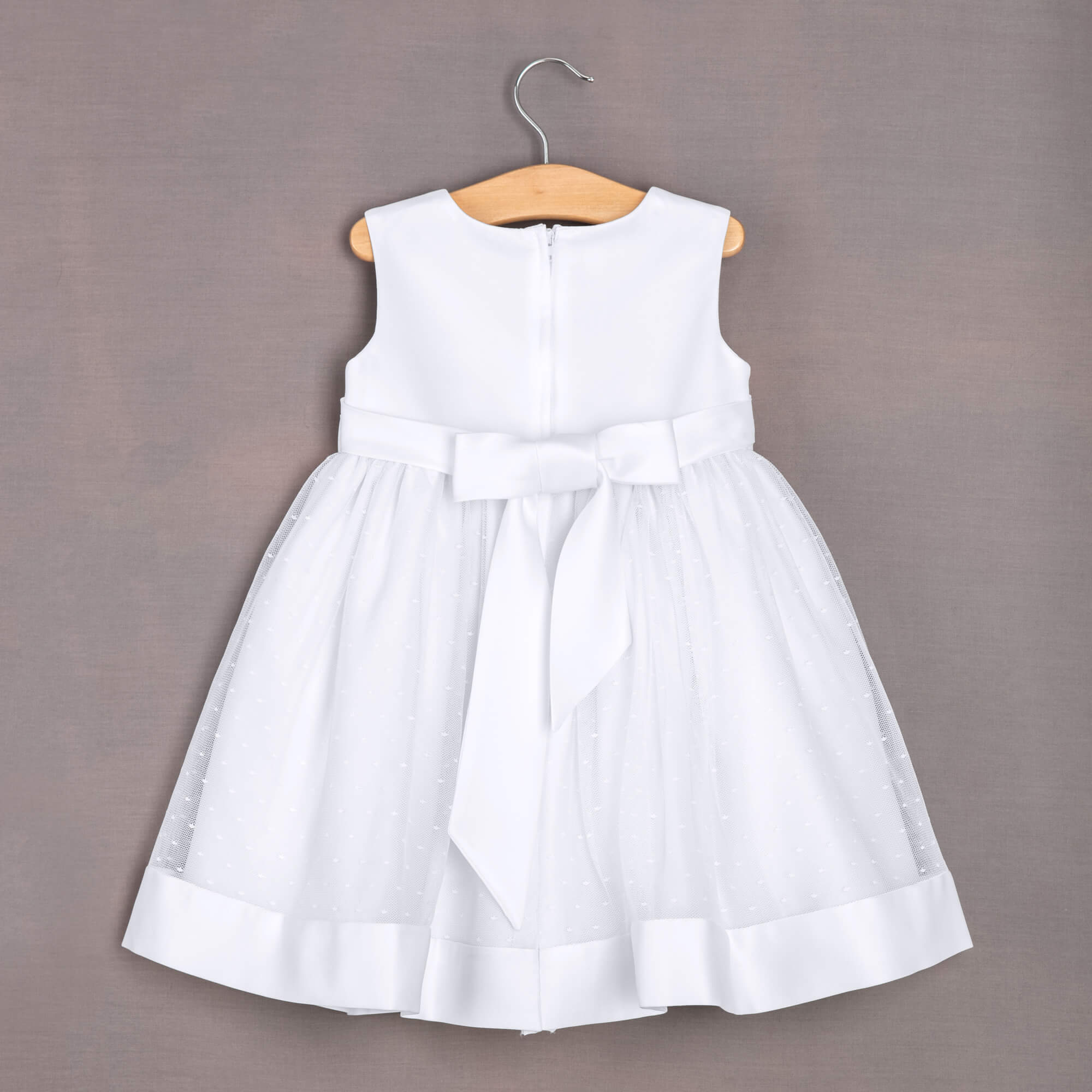 Grace dress hanging on hanger