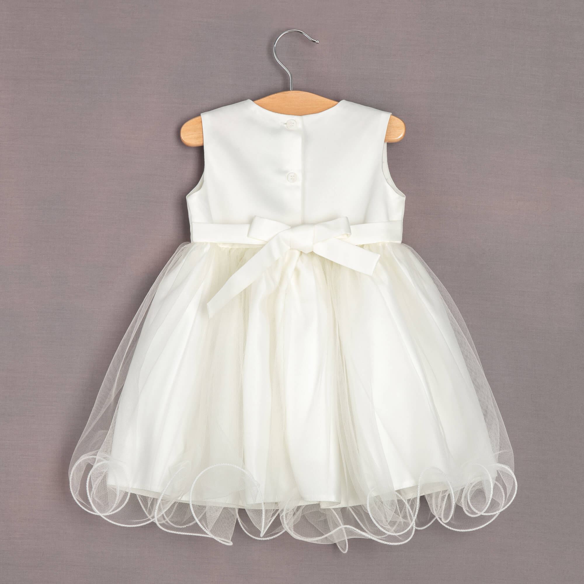 rear ivory pretty dress on hanger