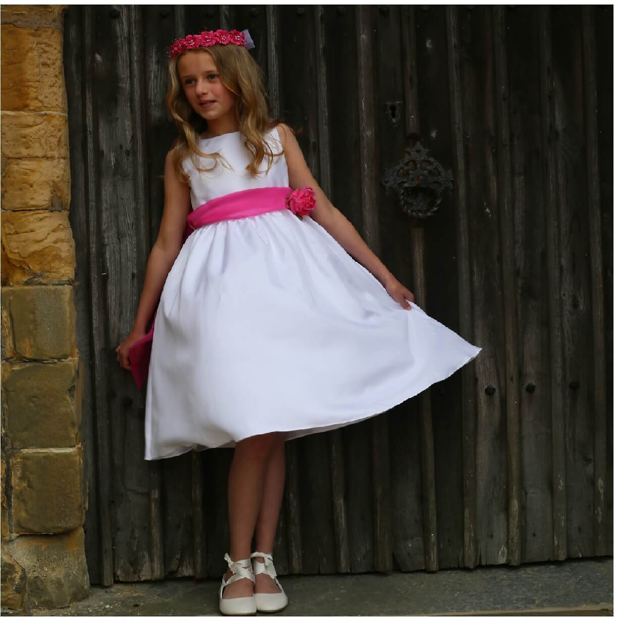 Young girl standing in church doorway