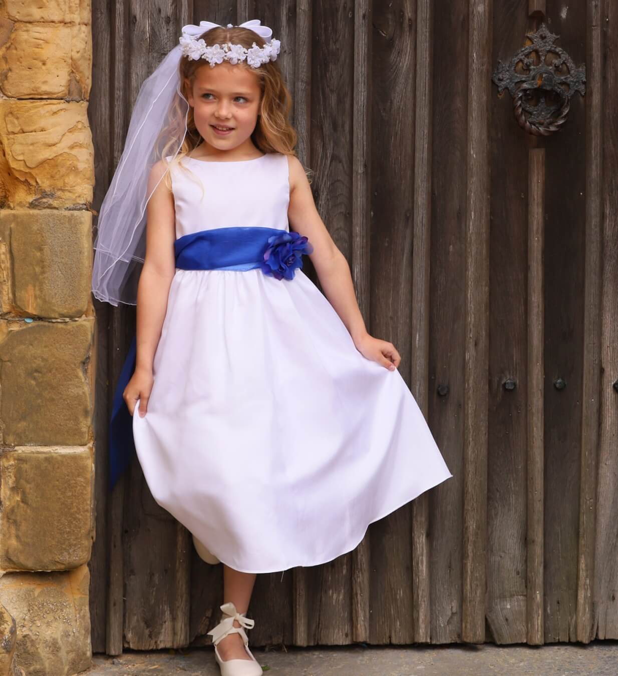 Young girl standing in church door