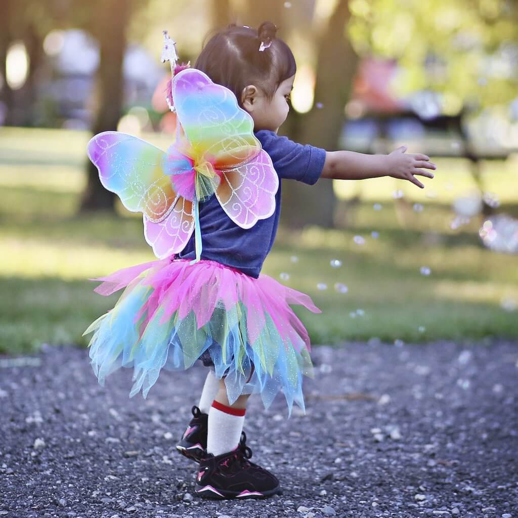 Girl playing in rainbow set