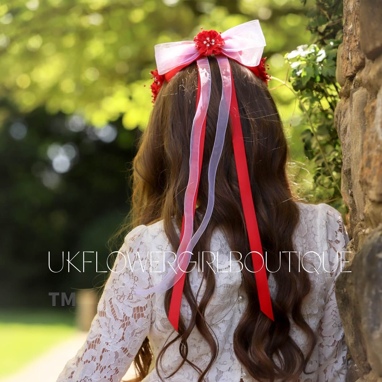 girls wearing detail ribbon and pearl crown