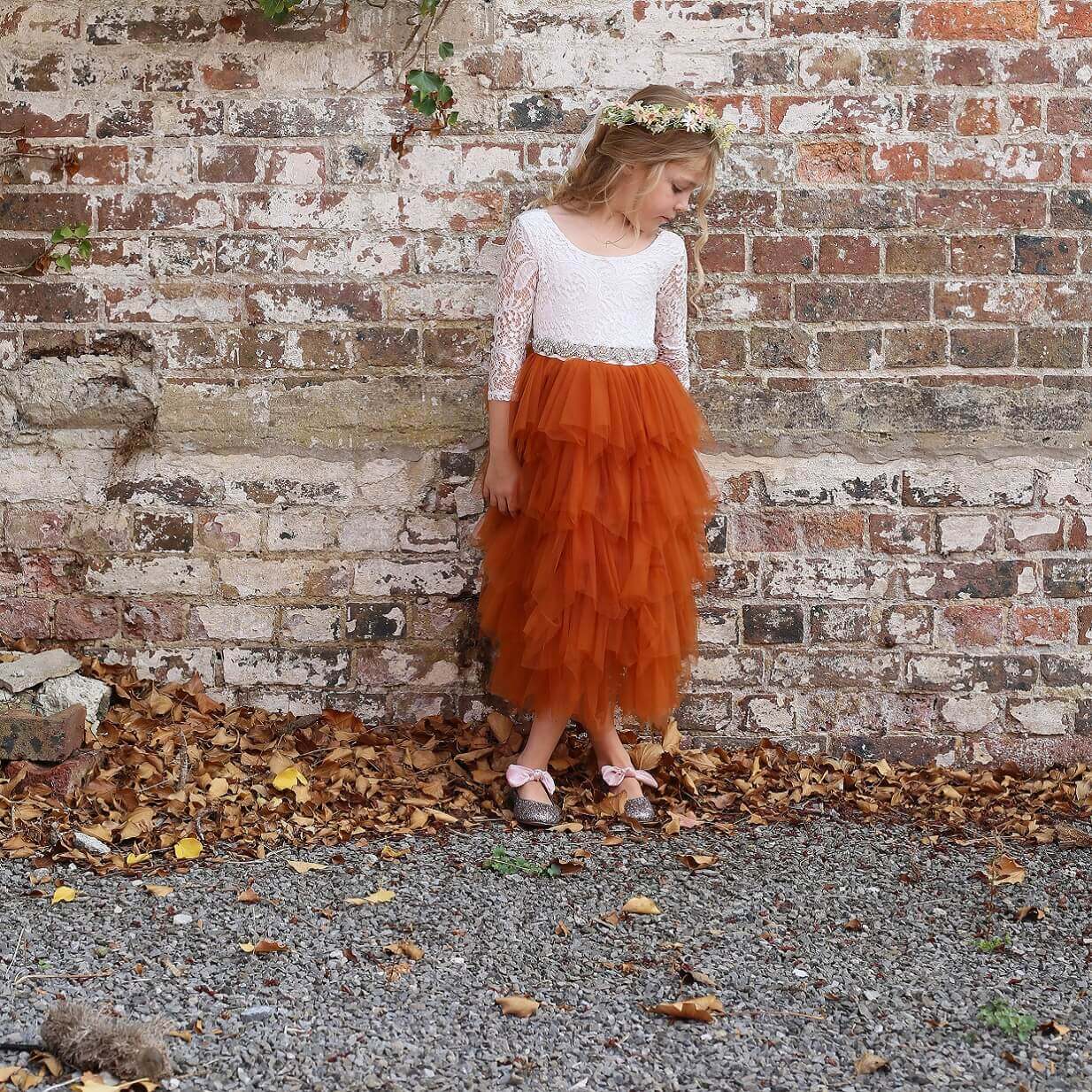 Young flower girl in pretty dress