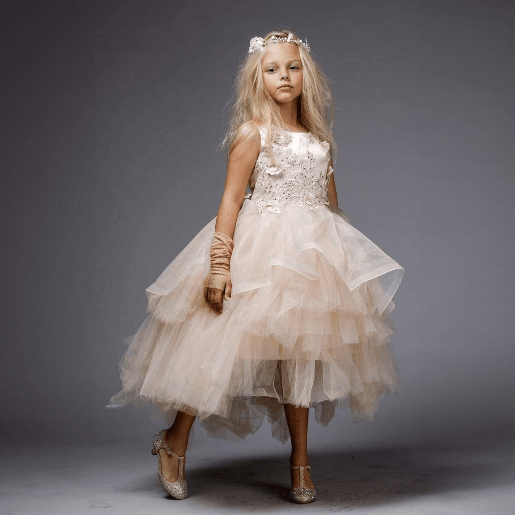 Model wearing a blush coloured Princess Evangeline party dress